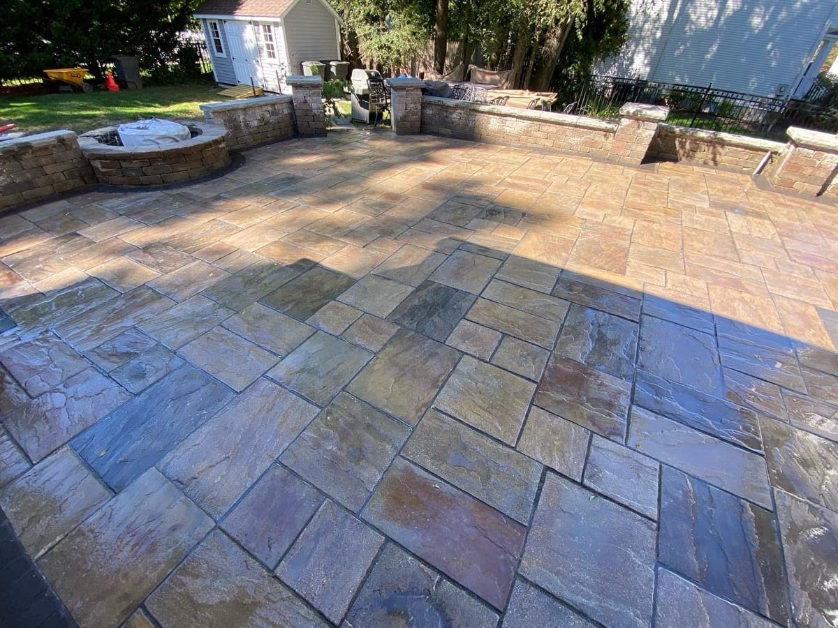 Completed patio construction with clean stone finish